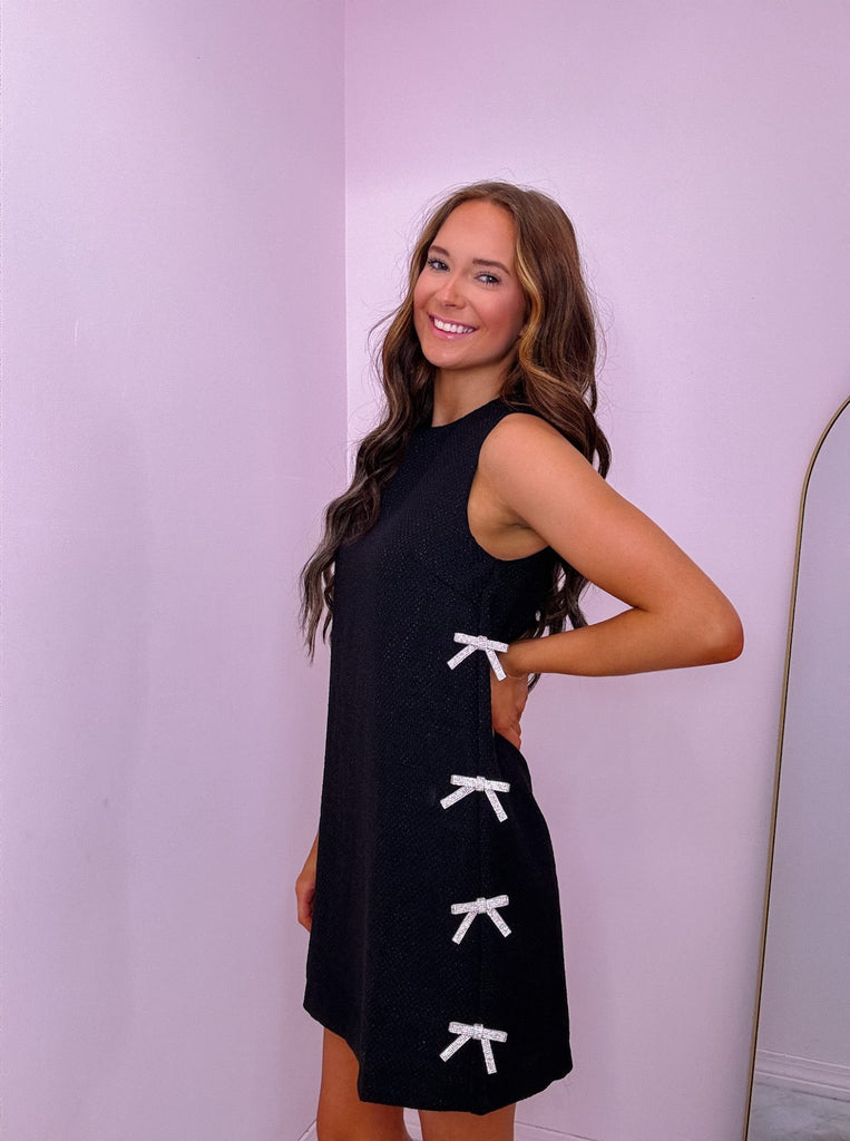 Black Textured Mini Dress with Diamond Bows Detail Oh So Spoiled Boutique Black Textured Mini Dress with Diamond Bows Detail Oh So Spoiled Boutique