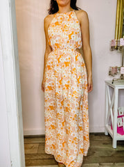 Orange blush floral print maxi dress with a high neckline, spaghetti straps, elastic waist and back tie keyhole closure. Lined.Orange blush floral print maxi dress with a high neckline, spaghetti straps, elastic waist and back tie keyhole closure. Lined.