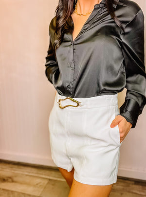 White bold belted linen shorts with side pockets, lined. 92% rayon & 8% polyester.