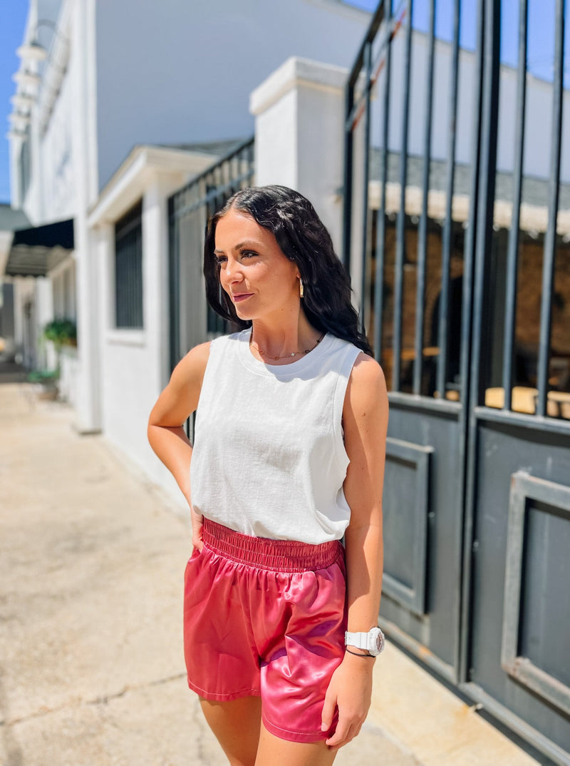 Rose pink elastic waisted shorts with front pockets.
