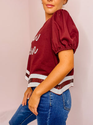 Maroon Touchdown sequined crop top with curved sequined hem.